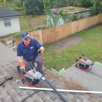 Owner Keith Cleaning a Drain Via Roof Vent